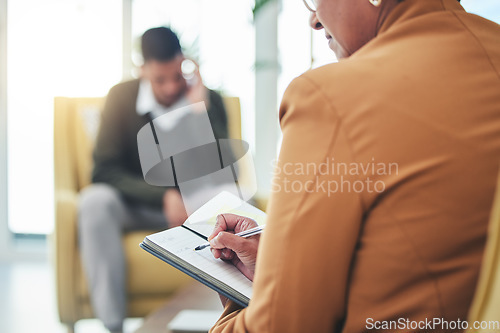 Image of Psychologist writing, man stress and sofa with woman, therapy and listen for mental health, mindset or care. Psychiatrist, depressed patient and frustrated in clinic, notebook and help for anxiety