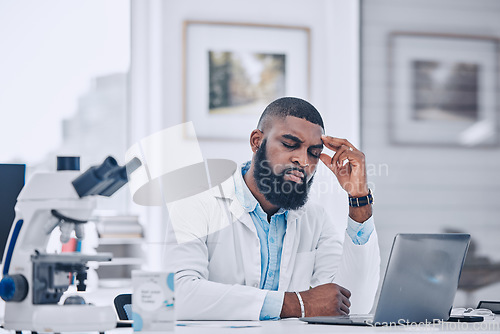 Image of Headache, stress and man with burnout from science, research mistake or laptop error in laboratory. Tired, sad or frustrated african scientist with migraine pain, anxiety and fatigue of mental health