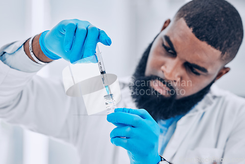 Image of Research, black man and vial with a syringe, medical and experiment for healthcare, analytics and vaccination. Person, scientist or research with syringe, test or pharmaceutical with vaccine expert