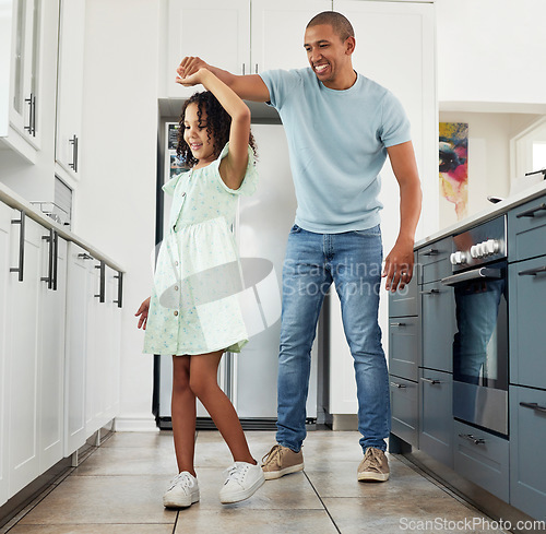 Image of Love, kitchen and father dancing with child in a in a home for care, happiness and bonding together in a house. Laughing, parent and dad playing with girl or kid as support spinning with energy