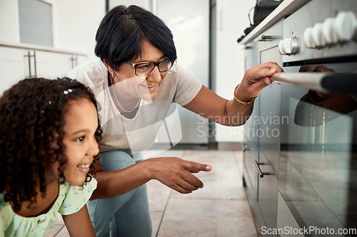 Image of Baking, oven and a senior woman with her grandchild in the kitchen of a home together for cooking. Family children and an elderly grandmother with a female kid in the house for learning or growth