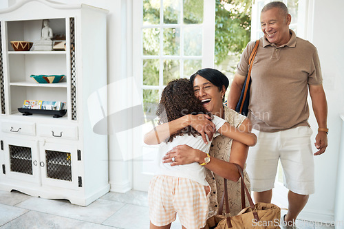 Image of Visit, home and girl hug grandparents by door excited for bonding, spending time and relationship. Family, happy and grandmother, grandfather and child embrace for greeting, welcome and arrival