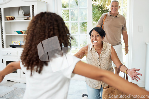 Image of Hello, home and girl running to grandparents by door excited for bonding, spending time and relationship. Family, happy and grandmother, grandfather and child embrace for greeting, welcome and visit