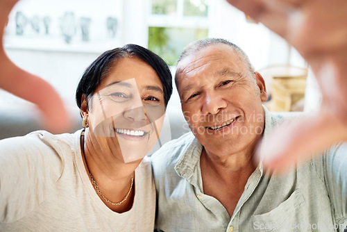 Image of Mature couple, selfie and smile portrait on home sofa for video call, streaming and internet. A happy man and woman together on a couch for social media profile picture or memory of healthy marriage