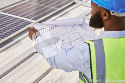 Image of Man, blueprint or engineer on rooftop or construction site for maintenance or architecture outdoor. Inspection, solar panel renovation or contractor building urban infrastructure with floor plan
