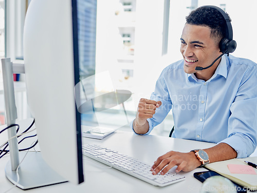 Image of Call center, man and success at computer for winner, telemarketing celebration and cheers. Happy telecom salesman at desktop to celebrate deal, bonus announcement and achievement of winning with fist