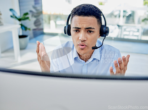 Image of Customer support, telemarketing and upset male consultant in the office doing an online consultation. Contact us, stress and professional man call center agent on a call with headset in the workplace