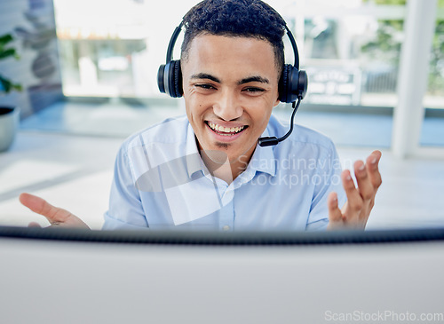 Image of Call center, customer support and man consultant in the office doing an online consultation. Contact us, crm and professional young male telemarketing agent working with a headset in the workplace.