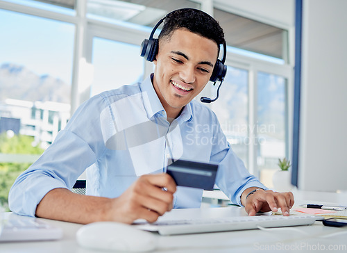 Image of Credit card, office and male consultant doing online shopping for a sale, promotion or discount. Ecommerce, Technology and man call center agent paying his bills, mortgage or debt online in workplace