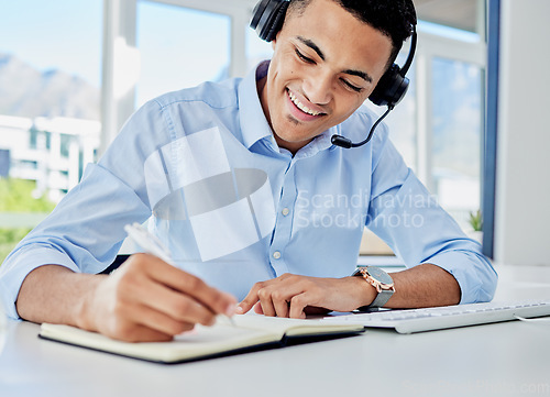 Image of Smile, call center and a man with a notebook for planning, telemarketing agenda or consulting notes. Happy, office and a customer service employee writing a strategy for online support or advice