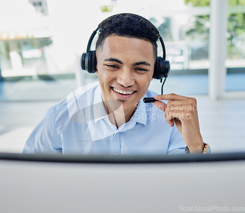 Image of Call center, business and man consultant in the office doing an online crm consultation. Contact us, ecommerce and professional young male telemarketing agent working with headset in the workplace.