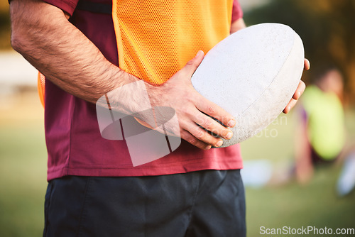 Image of Rugby, man and hands with ball for outdoor games, competition and contest on field. Closeup of athlete, sports player and match at stadium for fitness, exercise and performance challenge on pitch