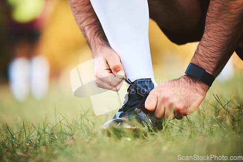 Image of Hands, rugby athlete and tie shoes to start workout, exercise or fitness. Sports, player and man tying boots in training preparation, game or competition for healthy body or wellness on field outdoor
