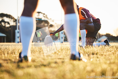 Image of Legs, ball and rugby, sports on field outdoor with team, target with fitness and train for match. Exercise, athlete people and play game with practice, health and active with grass, skill and player