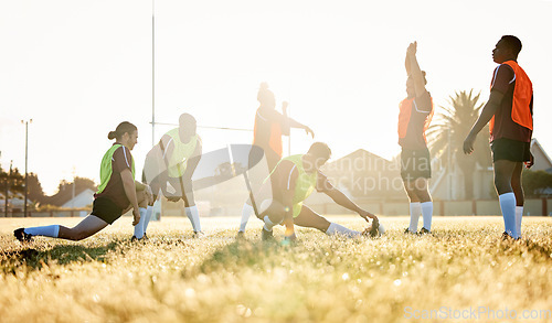 Image of Sports, fitness and a rugby team stretching on a field at training in preparation for a game or match together. Exercise, teamwork and warm up with an athlete group getting ready for practice