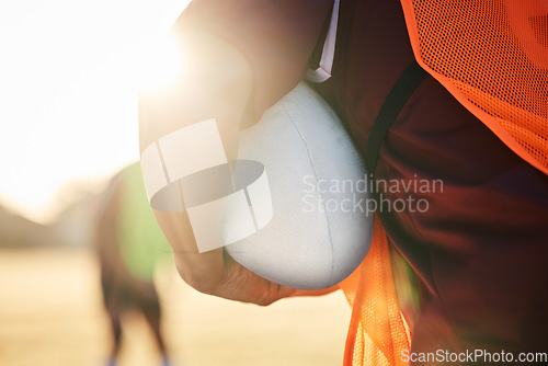 Image of Rugby, sports and hands on ball in exercise, workout or training outdoor at field lens flare. American football, fitness and man ready to start practice in game, competition or match for body health