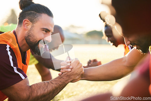 Image of Rugby, shaking hands and team exercise, training or cooperation at sunrise. Handshake, sports partnership and happy athlete group in trust agreement, solidarity and workout, fitness and collaboration