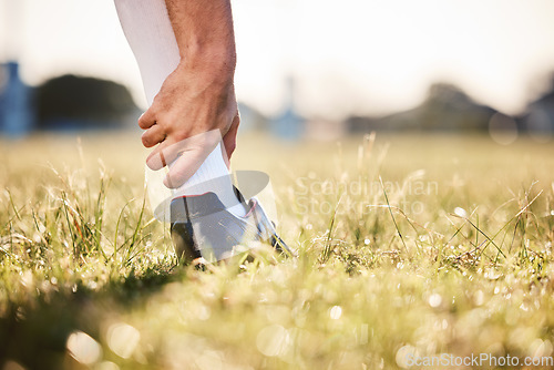 Image of Ankle pain, hand and injury with exercise accident, athlete outdoor with cramps and muscle tension. Fitness, sports and person with health crisis, closeup and grass with inflammation and osteoporosis