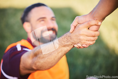 Image of Hands, rugby and teamwork with a man helping a friend while training together on a stadium field for fitness. Sports, exercise and team building with an athlete and teammate outdoor for support