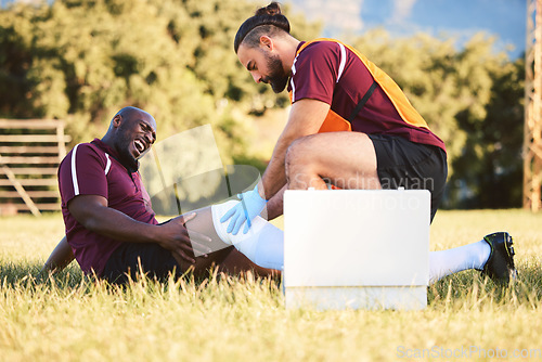 Image of Black man, knee pain and injury, medic help athlete and sports accident on field with health and wellness. Bandage leg, male healthcare worker and support with medical care, inflammation and fracture