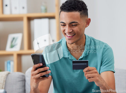 Image of Happy man, credit card and smartphone, online shopping and fintech with payment and discount on store website. Male customer at home, e commerce and internet banking with mobile app and finance