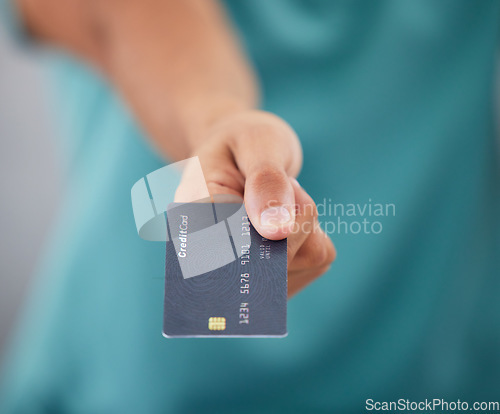 Image of Person giving credit card, hand and finance with payment, shopping and closeup with retail and store discount. Financial service, customer or client and economy with commerce, transaction and banking