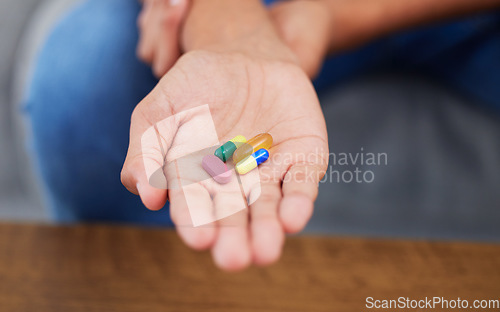 Image of Pills in hand, closeup and medicine with health, vitamin supplements and medical prescription. Drugs, wellness and healthcare with tablet for virus, sick person with medication and pharmaceutical