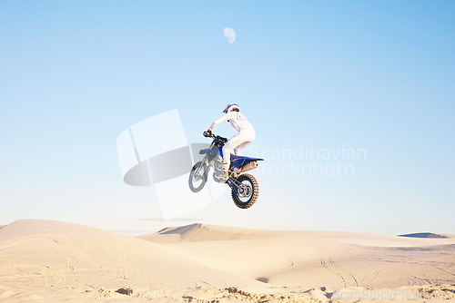 Image of Sports, cycling and man on motorbike on sand for adrenaline, adventure and freedom in desert. Competition, extreme action and male person on bike on dunes for training, exercise and race or challenge