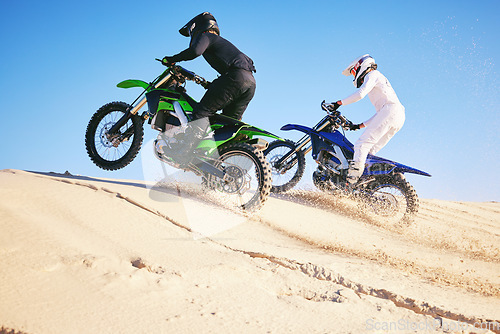 Image of Motorcycle, desert dune and fast in race, contest or outdoor hill climb for performance, goal or off road. Motorbike athlete, launch or ramp in nature, sand or speed for training in summer sunshine