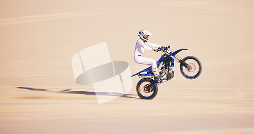 Image of Bike, sand and mockup with a man in the desert for adrenaline, adventure or training in nature. Moto, sports and balance with a male athlete riding a motorcycle for freedom or fitness on space