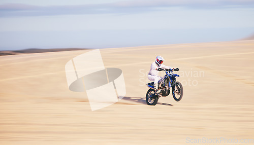 Image of Race, motorcycle and person in desert, action and extreme sport with speed, riding outdoor and mockup space. Adventure, fitness and training, motorbike exercise and freedom, challenge and performance