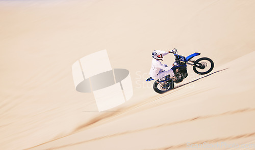 Image of Bike, sports and mockup with a man in the desert for fitness or adrenaline hobby for freedom. Motorcycle, training and summer with an athlete riding a vehicle in Dubai for energy from above on space