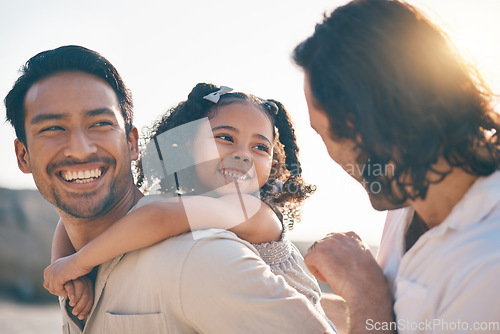 Image of Gay couple, piggyback and smile with family at beach for seaside holiday, support and travel. Summer, vacation and love with men and child in nature for lgbtq, happiness and bonding together