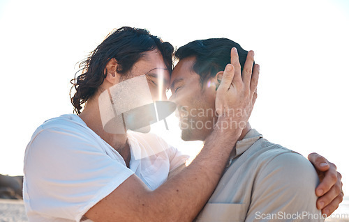 Image of Love, embrace and sun, gay couple on beach, smile and fun on summer vacation together in Thailand. Sunshine, ocean and island, happy lgbt men hug in nature for on holiday with pride, sea and care.