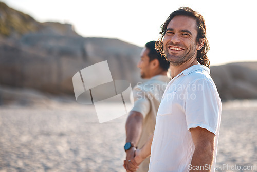 Image of Holding hands, portrait or happy gay couple on beach on fun summer vacation together in Brazil, Sao Paulo. Smile, ocean or lgbtq men walking in nature on romantic holiday with pride, freedom or care