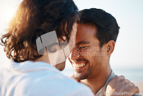 Image of Love, sunshine and gay men on beach, embrace and laugh on summer vacation together in Thailand. Sunshine, ocean and island, happy lgbt couple hug in nature on fun holiday with pride, sea and smile.