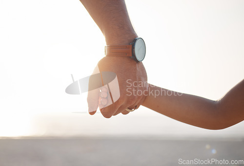 Image of Parent, father or kid holding hands in park in countryside nature together for support or care. Family, closeup or dad with child bonding or walking on holiday vacation with love, unity or trust