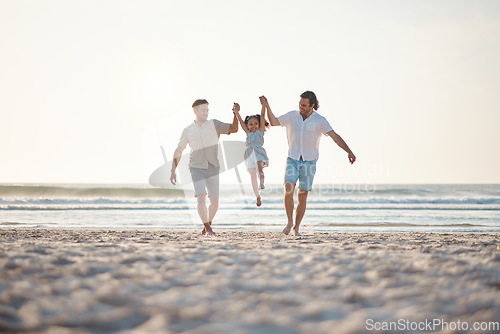 Image of Gay couple, playing and holding hands with family at beach for seaside holiday, support and travel. Summer, vacation and love with men and child in nature for lgbtq, happiness and bonding together