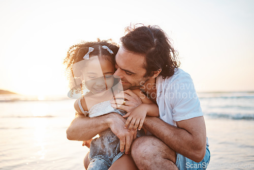 Image of Hug, happy and a child and father at the beach for holiday, care and love together after adoption. Summer, family and an interracial dad with a girl kid at the ocean for playing, travel or vacation