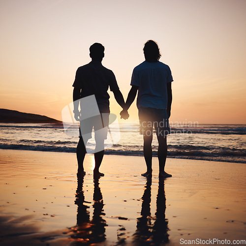 Image of Silhouette, holding hands and gay couple on beach, sunset and shadow on summer vacation together in Thailand. Sunshine, ocean and romance, lgbt men in nature and fun holiday with pride, sea and waves