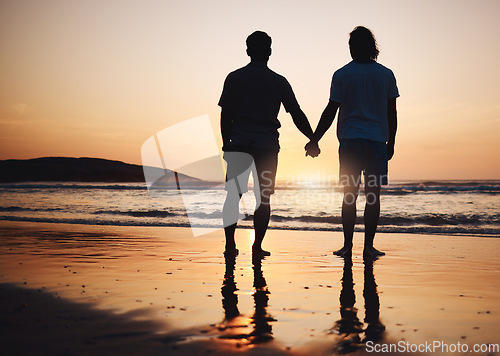 Image of Silhouette, holding hands and gay couple on beach, sunset and nature on summer vacation together in Thailand. Sunshine, ocean and romance, lgbt men on island and fun holiday with pride, sea and waves