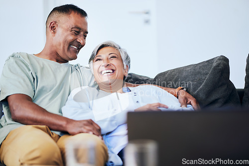 Image of Laugh, relax and mature happy couple on sofa, embrace and funny time in living room of house. Smile, man and woman on couch with comic hug, marriage relationship and fun retirement in home together.