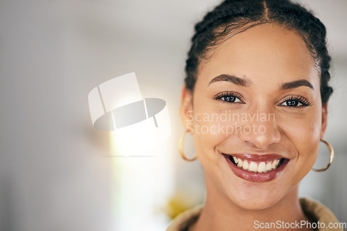 Image of Happy, smile and face of a young woman with makeup and beauty and space with positive attitude. Portrait of female person from South Africa with freedom, happiness or to relax at a house or apartment
