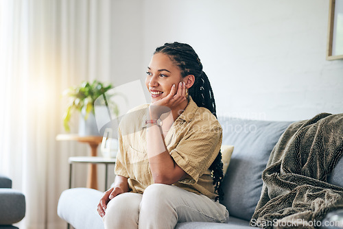 Image of Happy, African woman and thinking in home about interior design, decoration or idea in apartment, living room or house. Girl, relax and lounge on sofa with inspiration, goals or peace in life