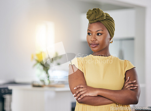 Image of Thinking, relax and a black woman with arms crossed in a house for a vision, idea or planning. Calm, home and an African girl or person with confidence and motivation in a living room of an apartment