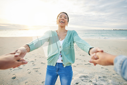 Image of Couple, pov and holding hands on beach for love with people outdoor at sunset together. Nature, spinning and funny with a happy woman laughing on the sand on a fun date for summer holiday and travel