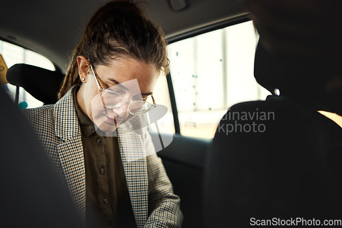 Image of Taxi, car and business woman travel or commute in a vehicle ride and transport backseat in the morning to work. City, drive and professional person, employee or passenger in a trip or journey