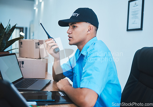 Image of Walkie talkie, security guard and man at table in surveillance, communication in an office. Safety, protection and serious officer on radio at desk to chat on tech in police investigation service.