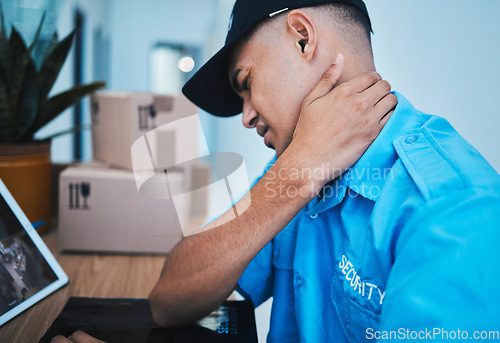 Image of Burnout, desk and a security man with neck pain, health or stress from work in safety. Frustrated, tired and a bodyguard or worker with a muscle injury, inflammation or feeling after an accident