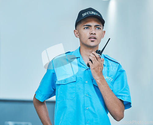 Image of Security guard, walkie talkie and man in office in surveillance, communication or conversation. Safety, protection and serious bodyguard on radio to chat on tech in police investigation or inspection